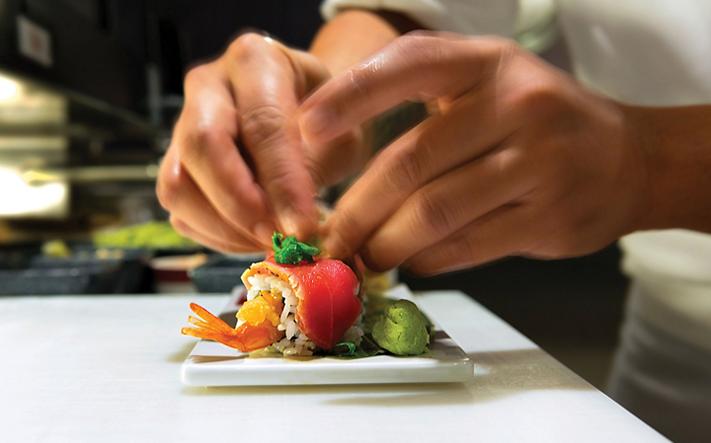 Chef preparing sushi at Izumi